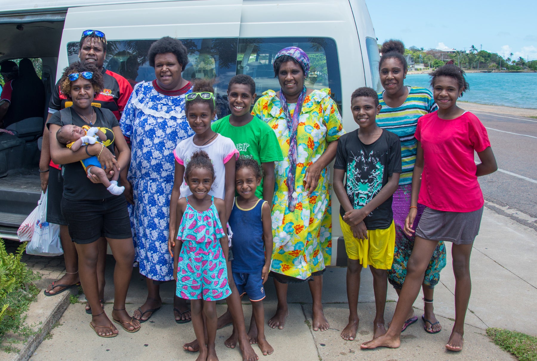 A Torres Strait Islander family on a beautiful beach.