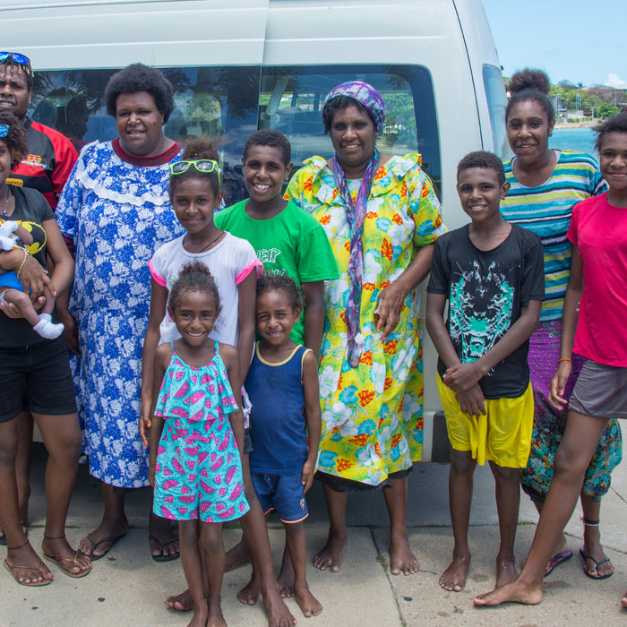 A Torres Strait Islander family on a beautiful beach.