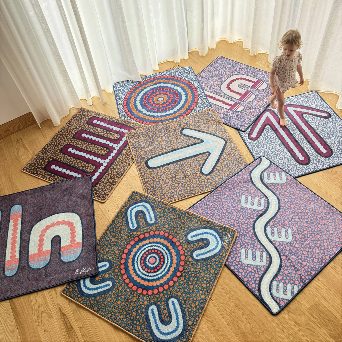 Indigenous Symbols Rug Squares close-up detail showing Aboriginal symbols designed by Wiradjuri artist Shareen Clayton — available in 50cm and 100cm