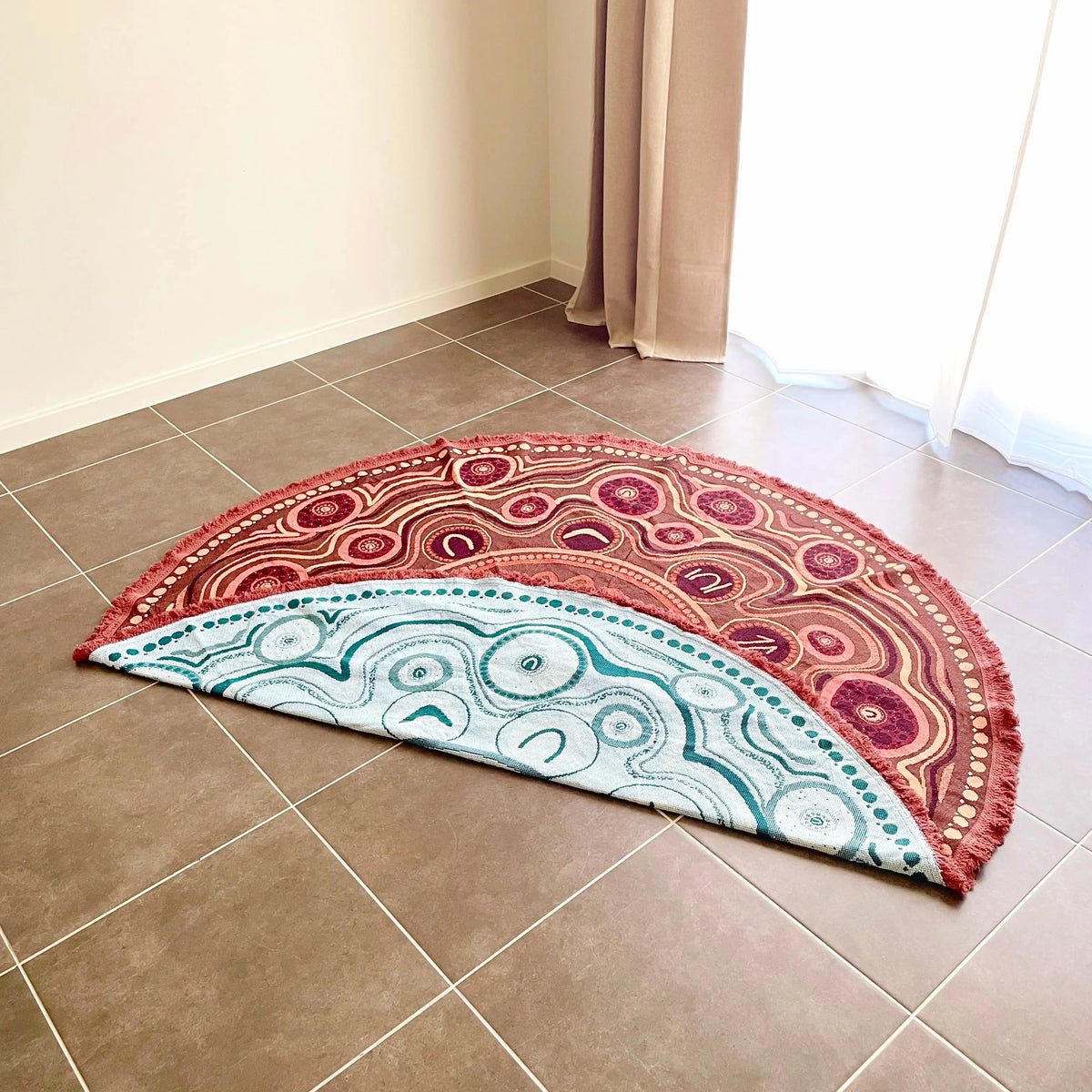 Yarning Circle Cotton Throw styled in classroom reading nook — pairs with Yarning Circle Cushion Cover for a coordinated Indigenous art reading corner