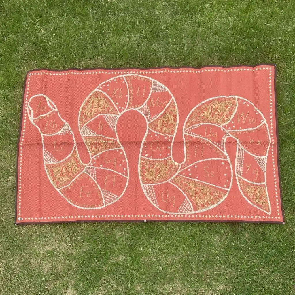 Rainbow Serpent Alphabet Outdoor Mat in use — children learning alphabet on Indigenous art outdoor mat, weatherproof and UV resistant
