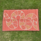 Rainbow Serpent Alphabet Outdoor Mat in use — children learning alphabet on Indigenous art outdoor mat, weatherproof and UV resistant