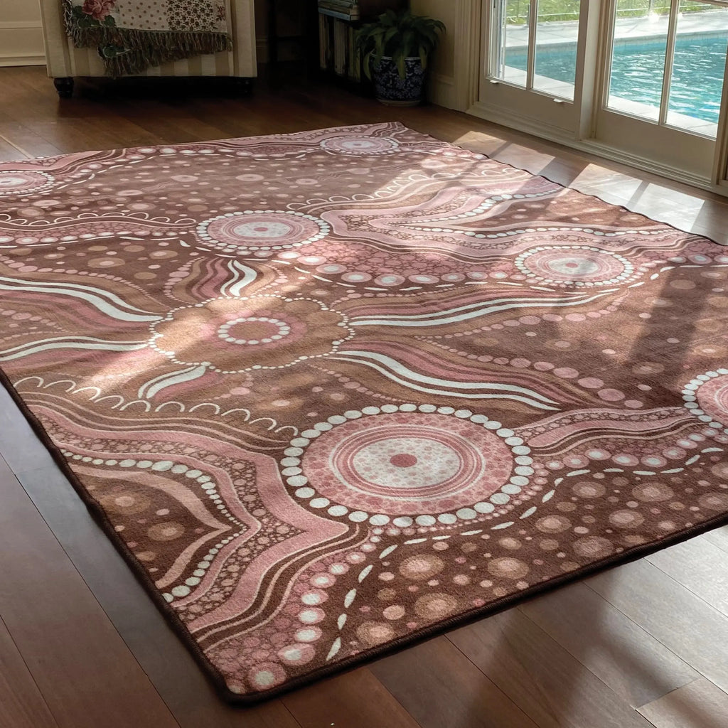 Aboriginal Art Bush Dreaming rug in classroom — children sitting on Indigenous art rug during group reading time
