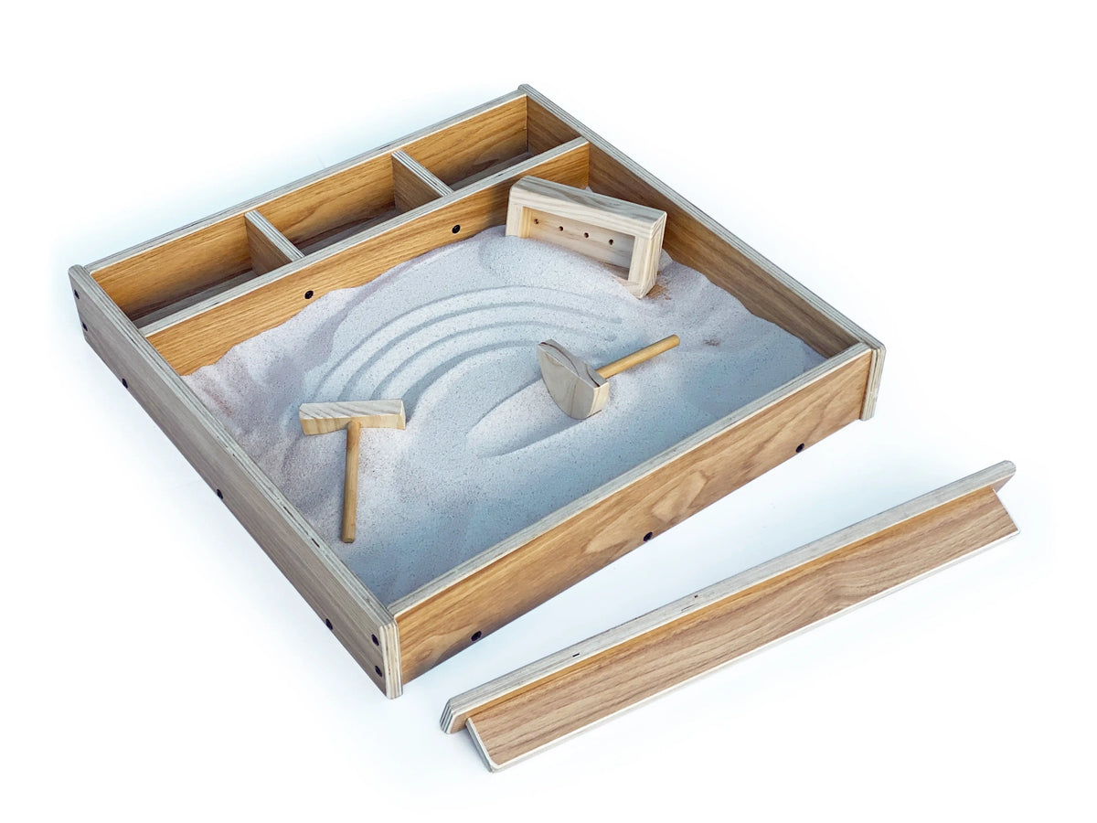 Sand box with screed and 3 tools — screed in use detail