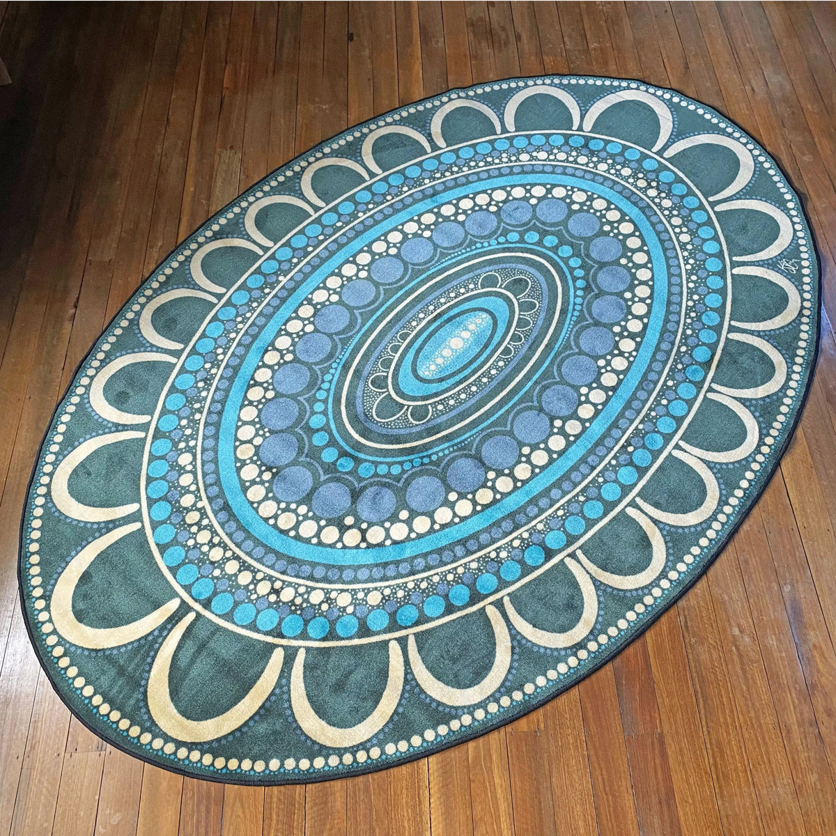 Yarning Oval Indigenous rug detail showing Aboriginal dot art design by Kiz Costelloe — bestselling oval classroom rug for Australian schools