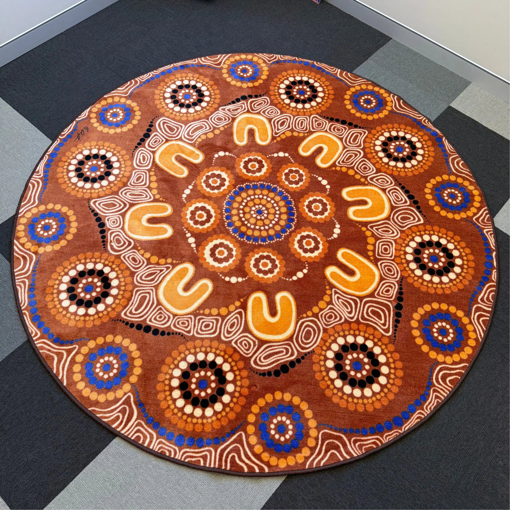 Yarning Camp rug in classroom setting — children gathered on Aboriginal art rug for group learning and yarning circle time